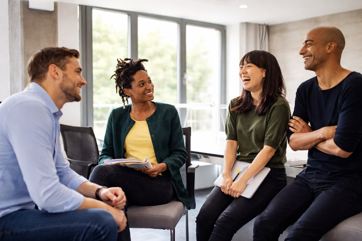 Team members in discussion during a collaborative office meeting