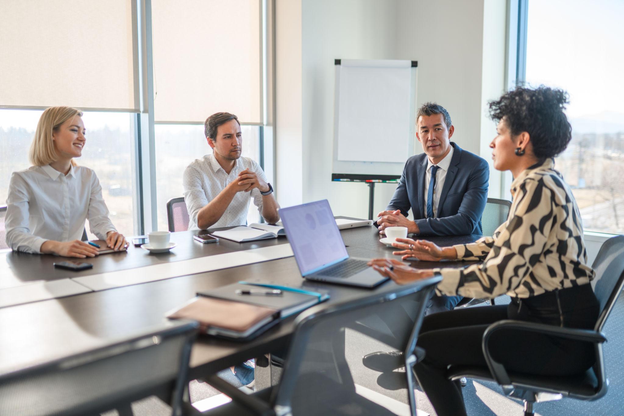 Hiring team meeting around a conference table